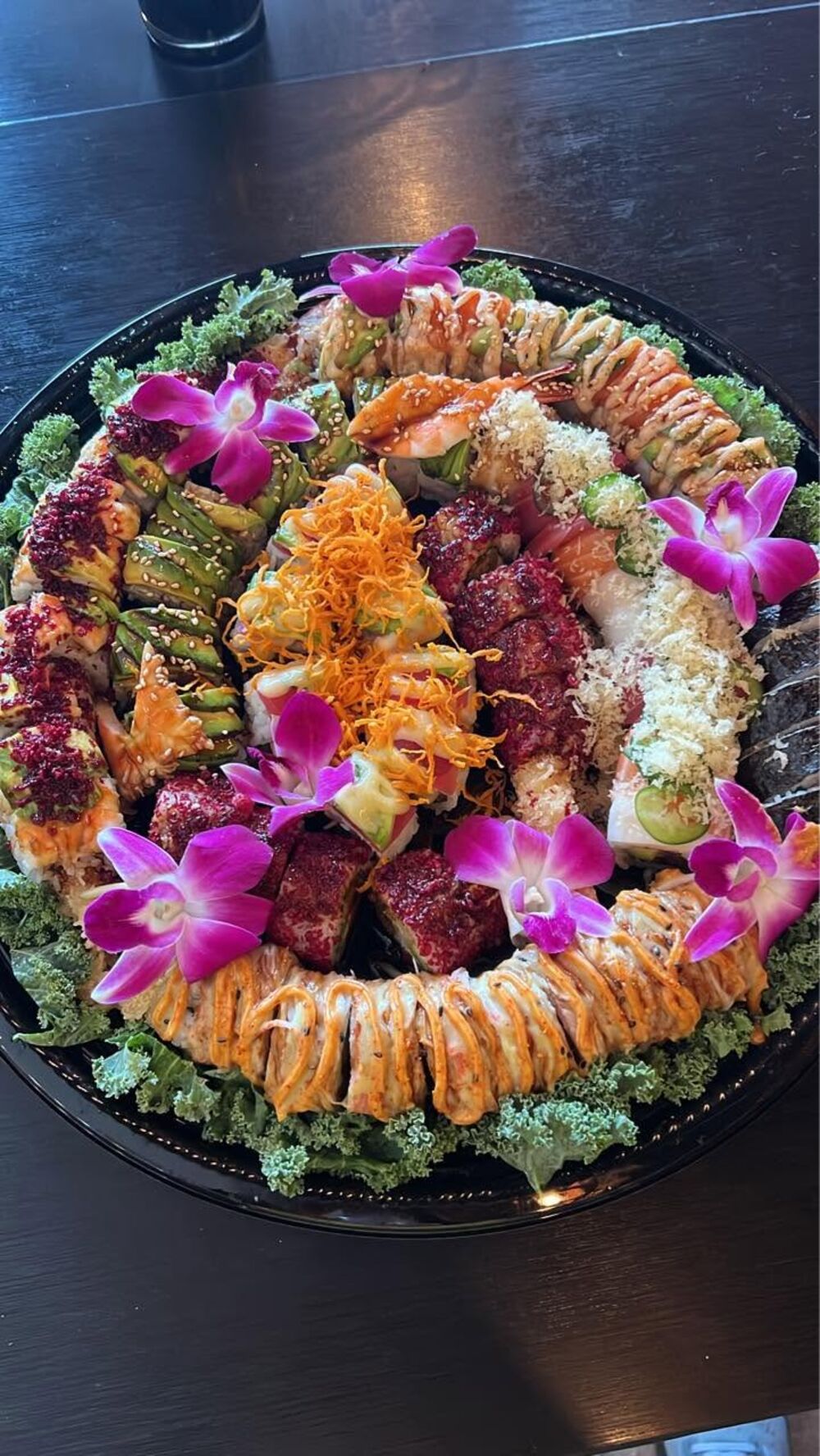Signature party platter garnished with orchids at Sushi Wabi